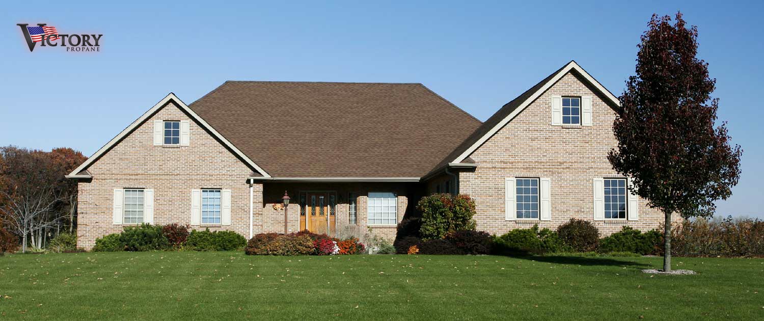 residential two story home looking at the front lawn and door