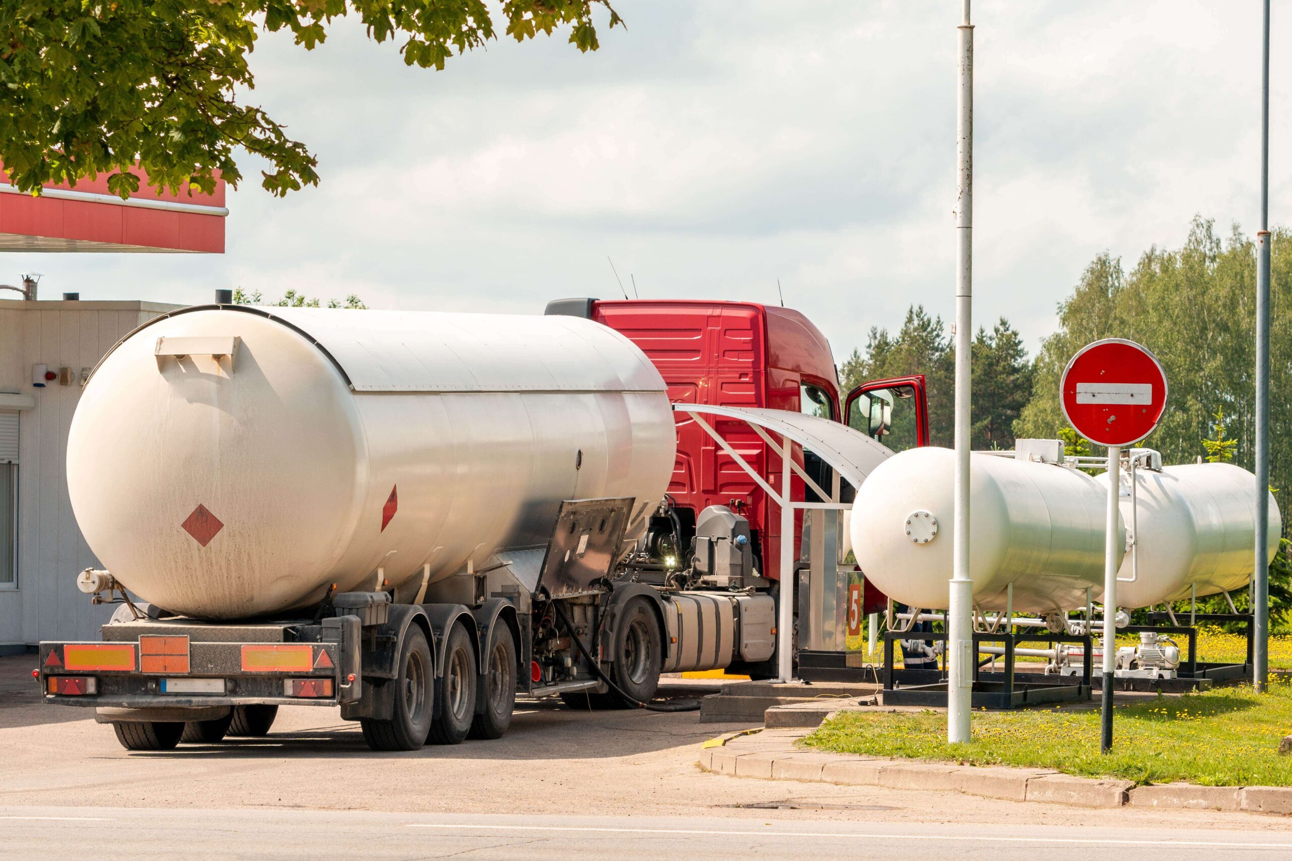 eighteen wheeler truck at a fueling station